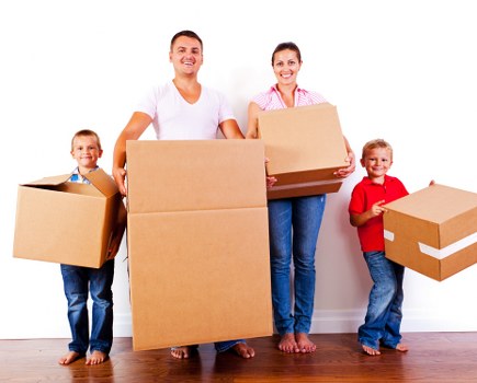 Packed office boxes and furniture ready for relocation