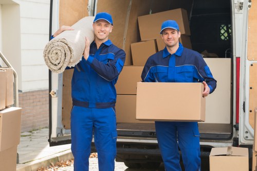 Furniture and office items being loaded into a moving van
