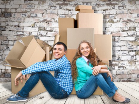 Packed moving boxes and furniture for a home relocation