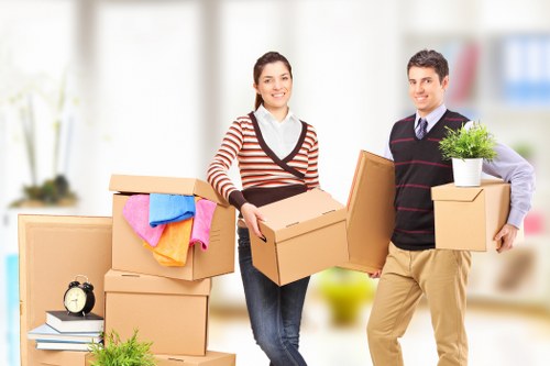 Professional movers loading items for a Hounslow home move