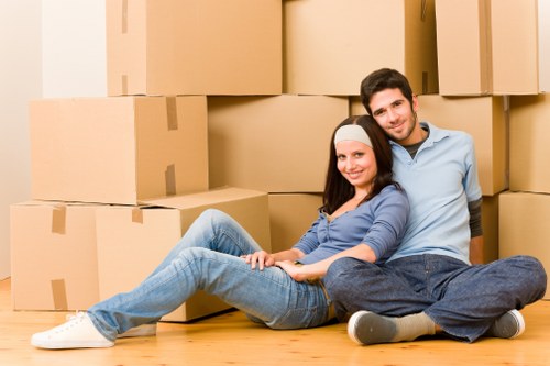 Packed moving boxes and furniture ready for transport in Hounslow