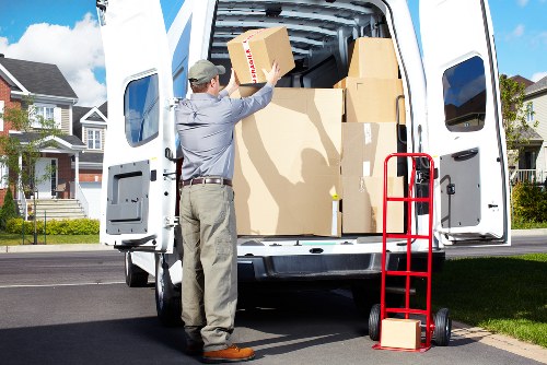 Packed boxes and furniture ready for loading during a Hounslow move