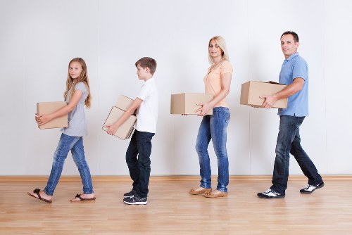 Packed boxes and labelled rooms prepared for a house move in Hounslow