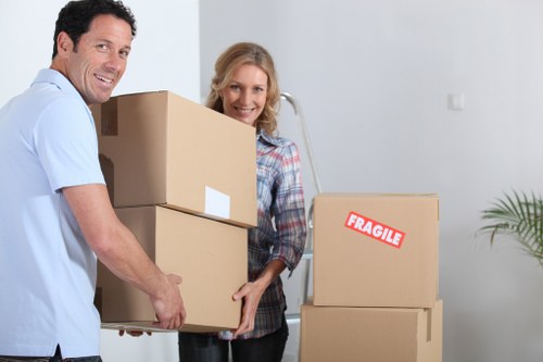 Loading furniture into a van for a Hounslow removal job